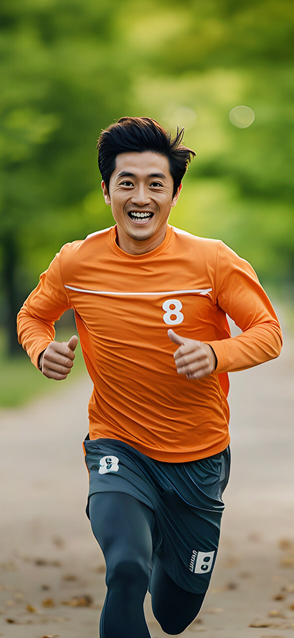 Tiger-Balm-Active-Sports-young asian man running in orange shirt in a park